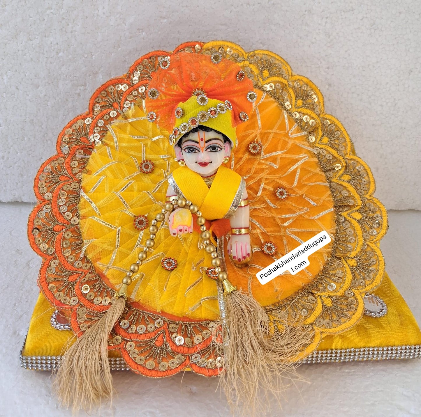 Yellow-orange poshak with pagdi